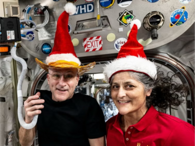 Stranded Astronauts Wearing Christmas Apparel--More Scam?